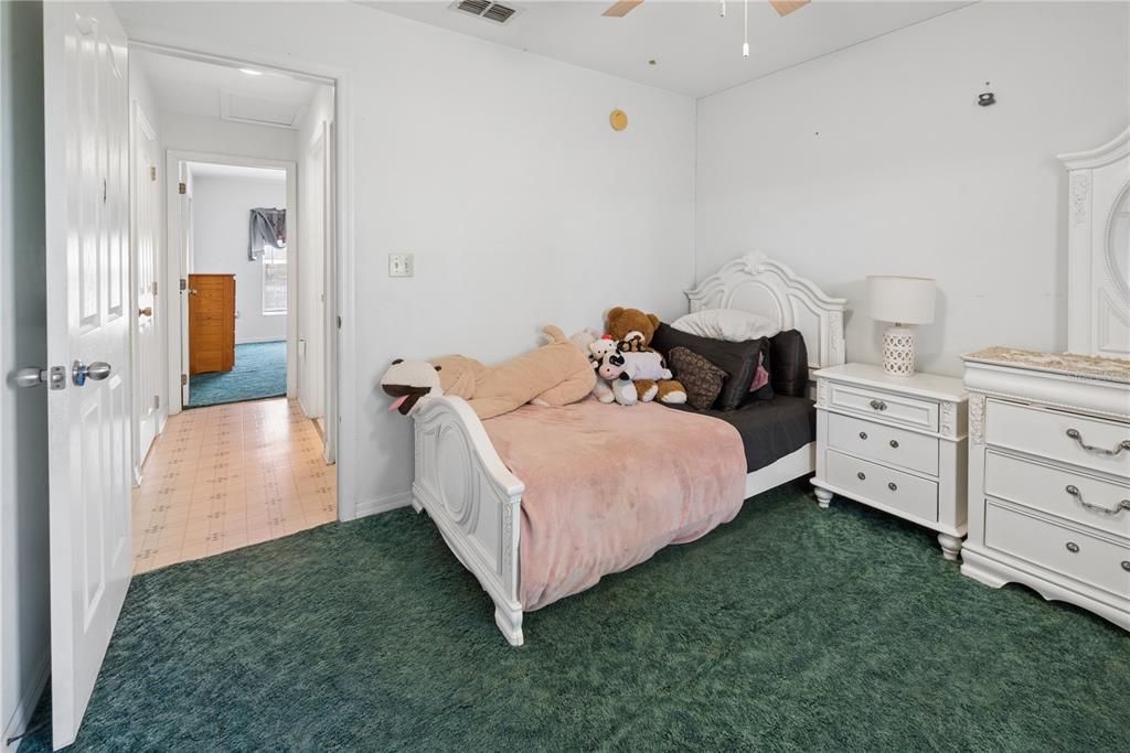 1750 Southwest 15th Street Bell, FL 32619 - Photo 17 of 34 a bed room with a bed and a view of bedroom