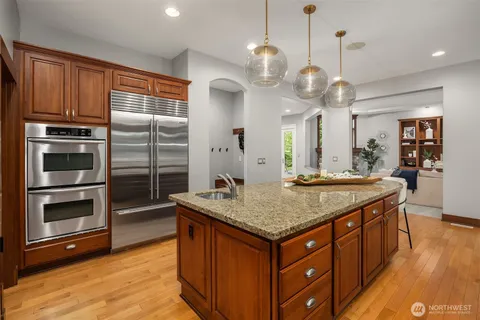 a kitchen with a counter space cabinets and appliances