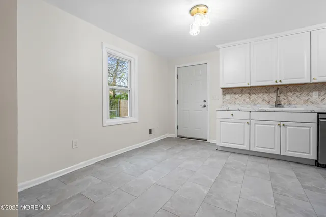 a view of a kitchen with electric appliances