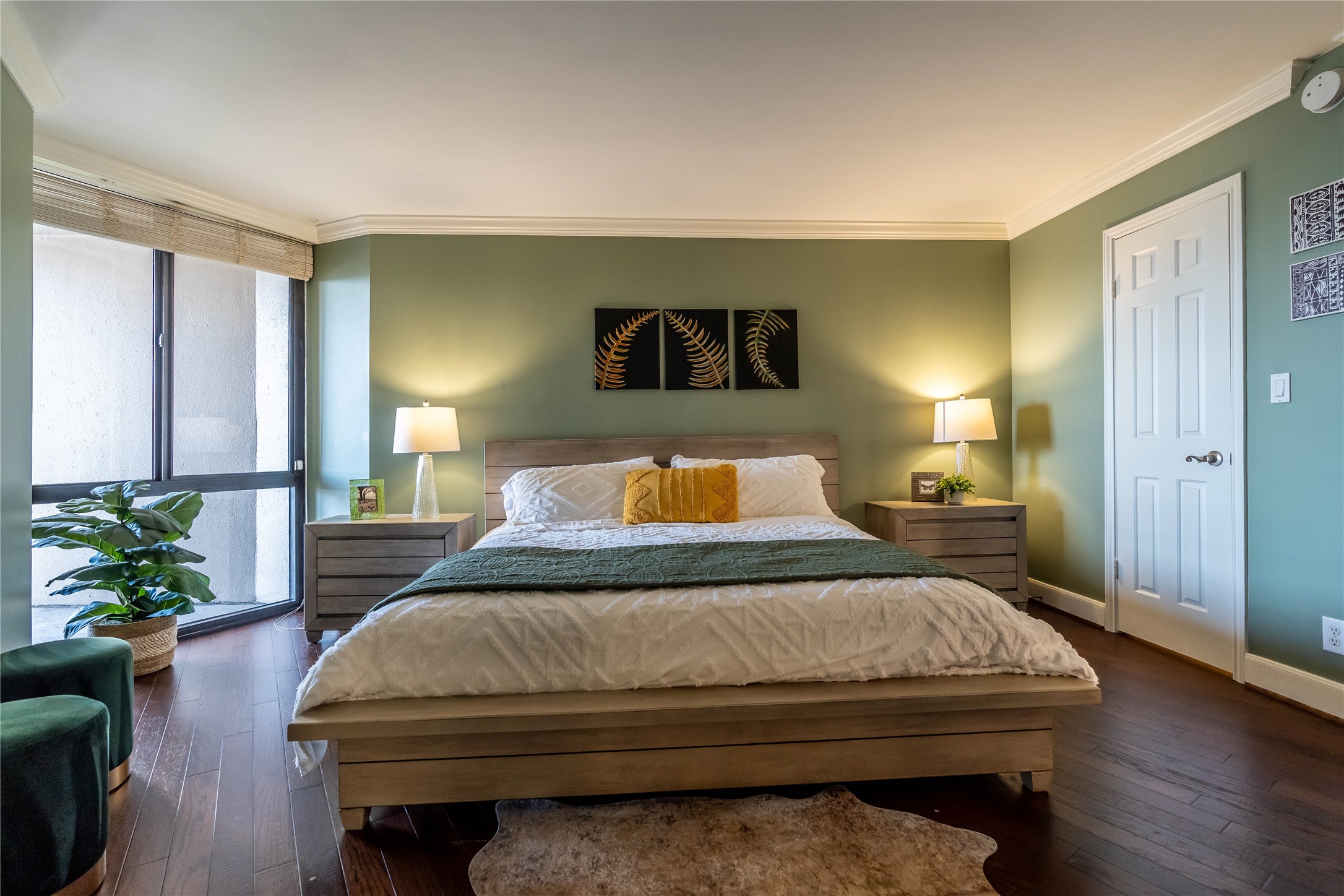 3525 Sage Road, Unit 1313 Houston, TX 77056 - Photo 7 of 18 a bedroom with a bed and wooden floor