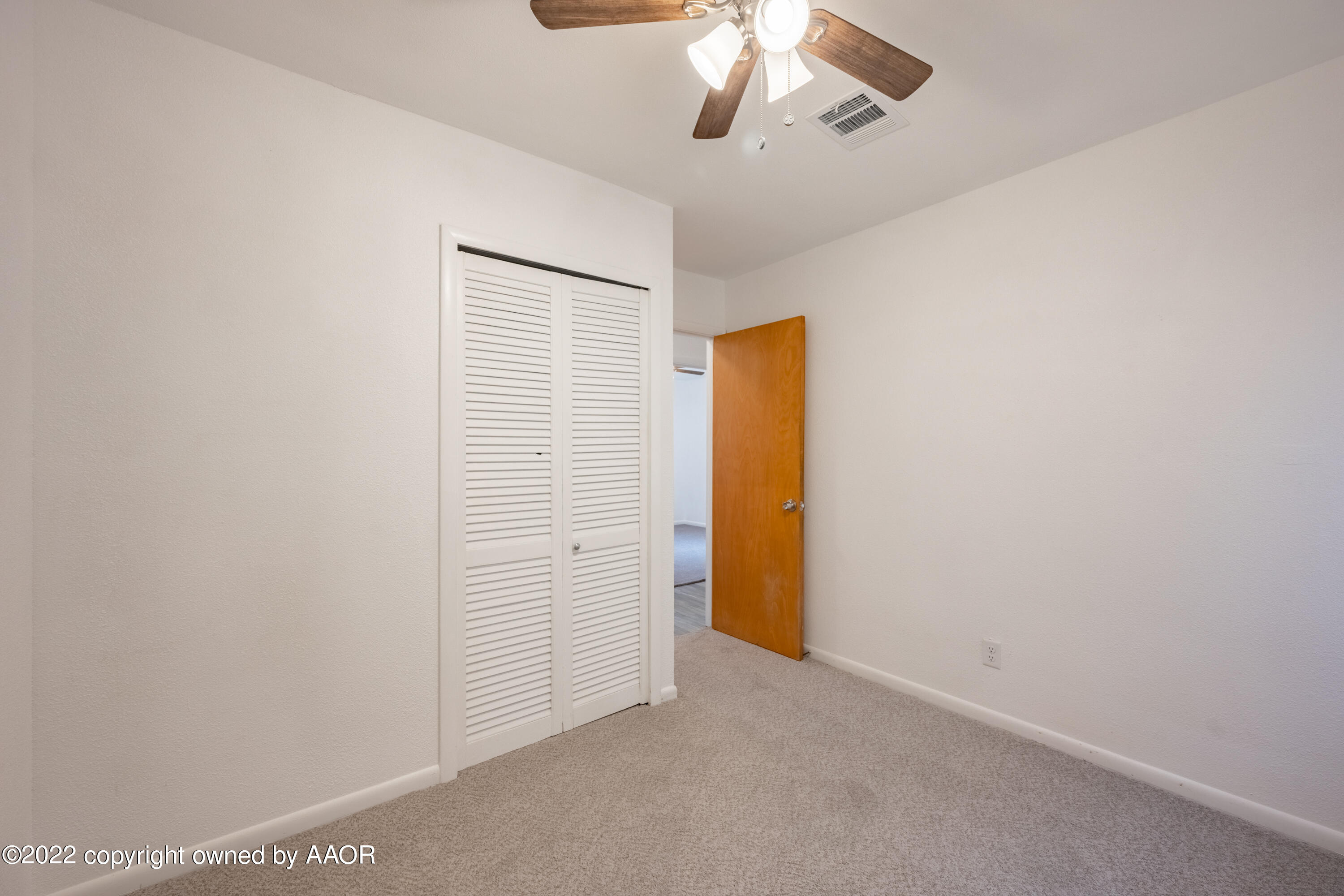 5311 Allen Street Amarillo, TX 79110 - Photo 14 of 22 an empty room with a chandelier fan