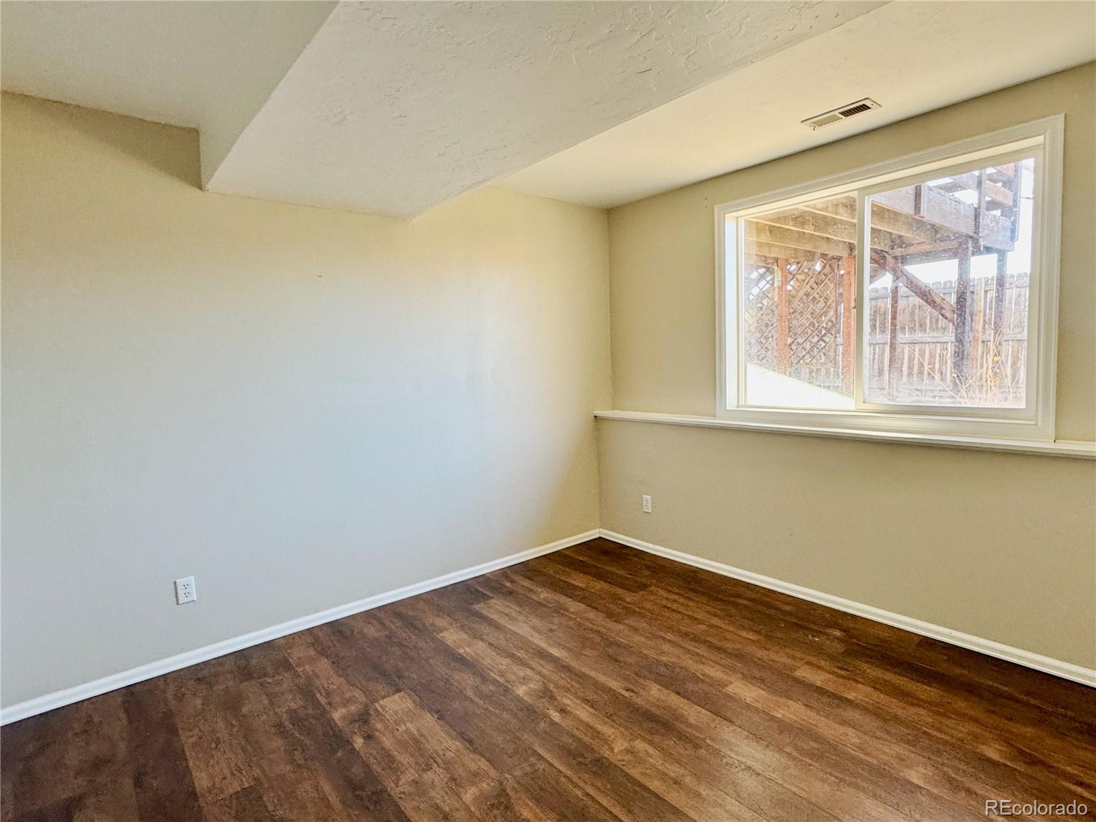 401 Rider Road Rangely, CO 81648 - Photo 17 of 23 an empty room with a window