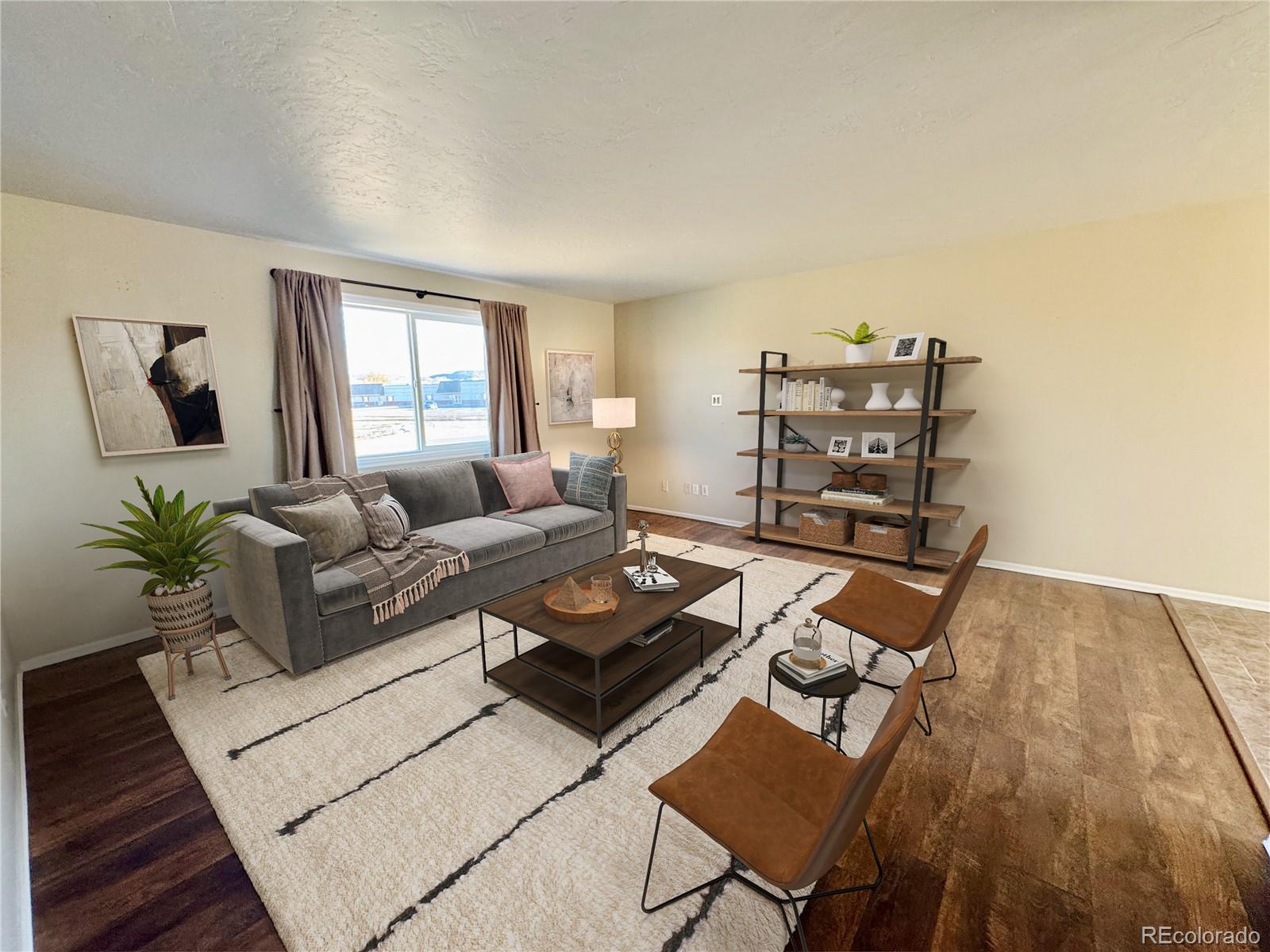 401 Rider Road Rangely, CO 81648 - Photo 2 of 23 a living room with furniture and a wooden floor