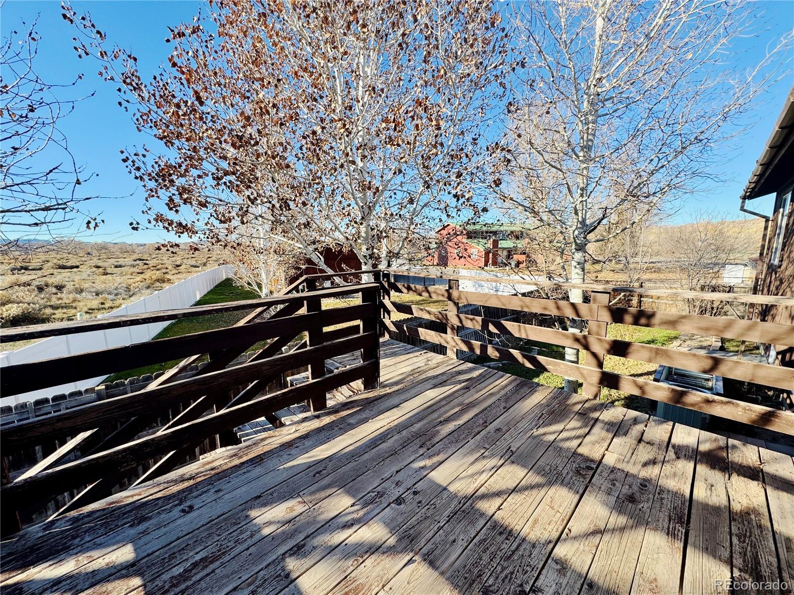 401 Rider Road Rangely, CO 81648 - Photo 21 of 23 a city view with wooden floor and city view