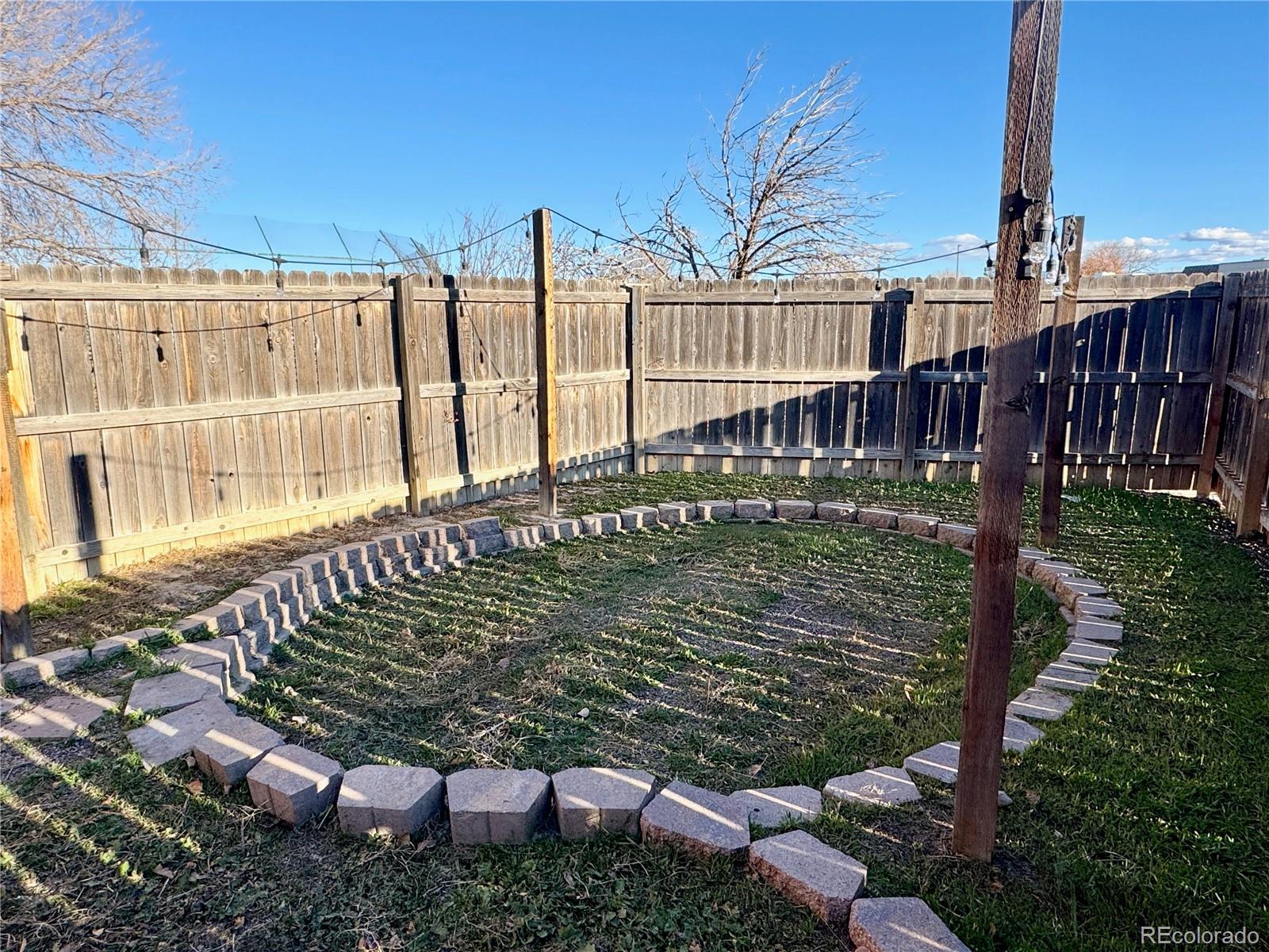 401 Rider Road Rangely, CO 81648 - Photo 22 of 23 a view of a backyard with sitting area