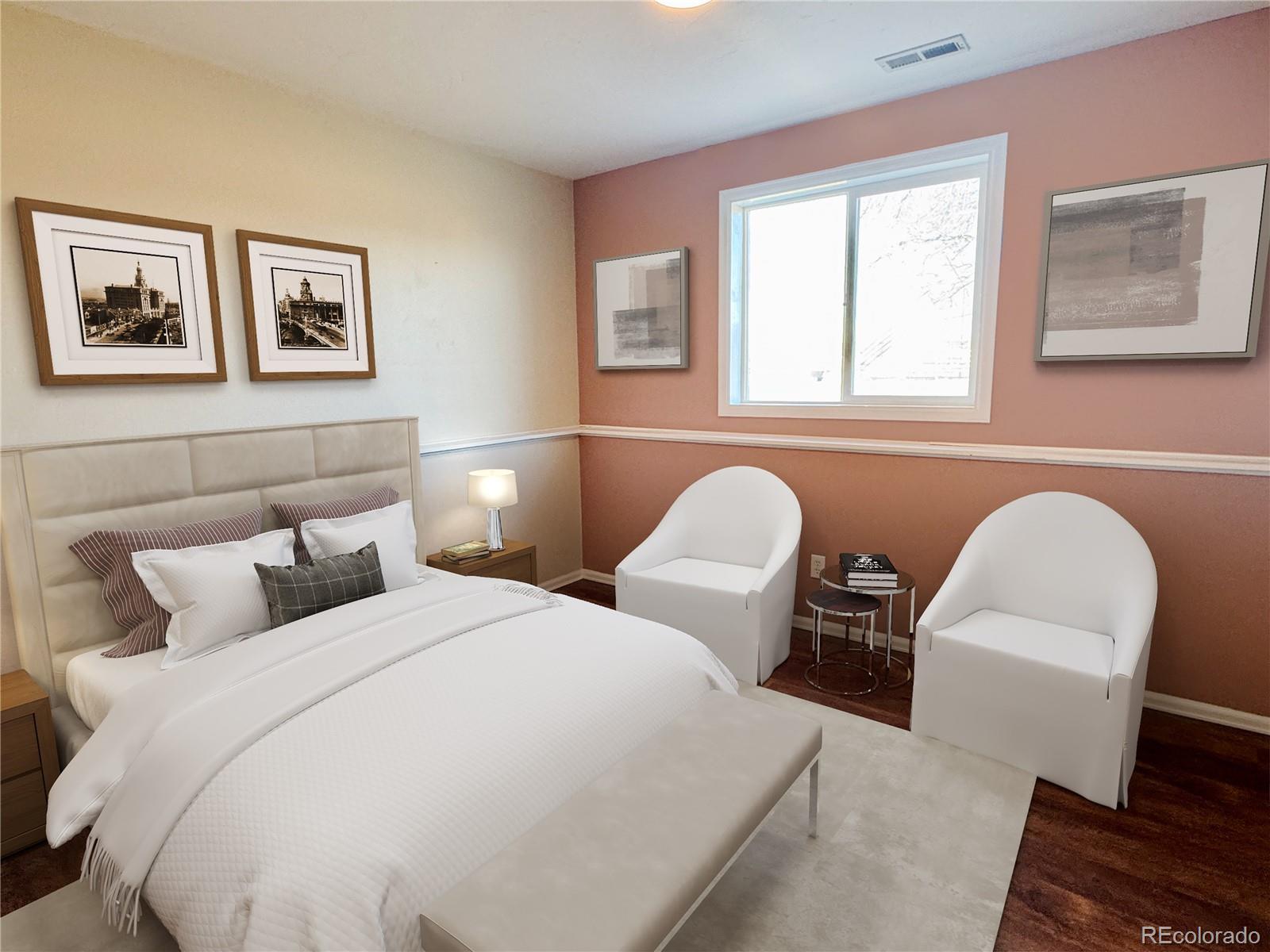 401 Rider Road Rangely, CO 81648 - Photo 5 of 23 a bedroom with two beds and a large window