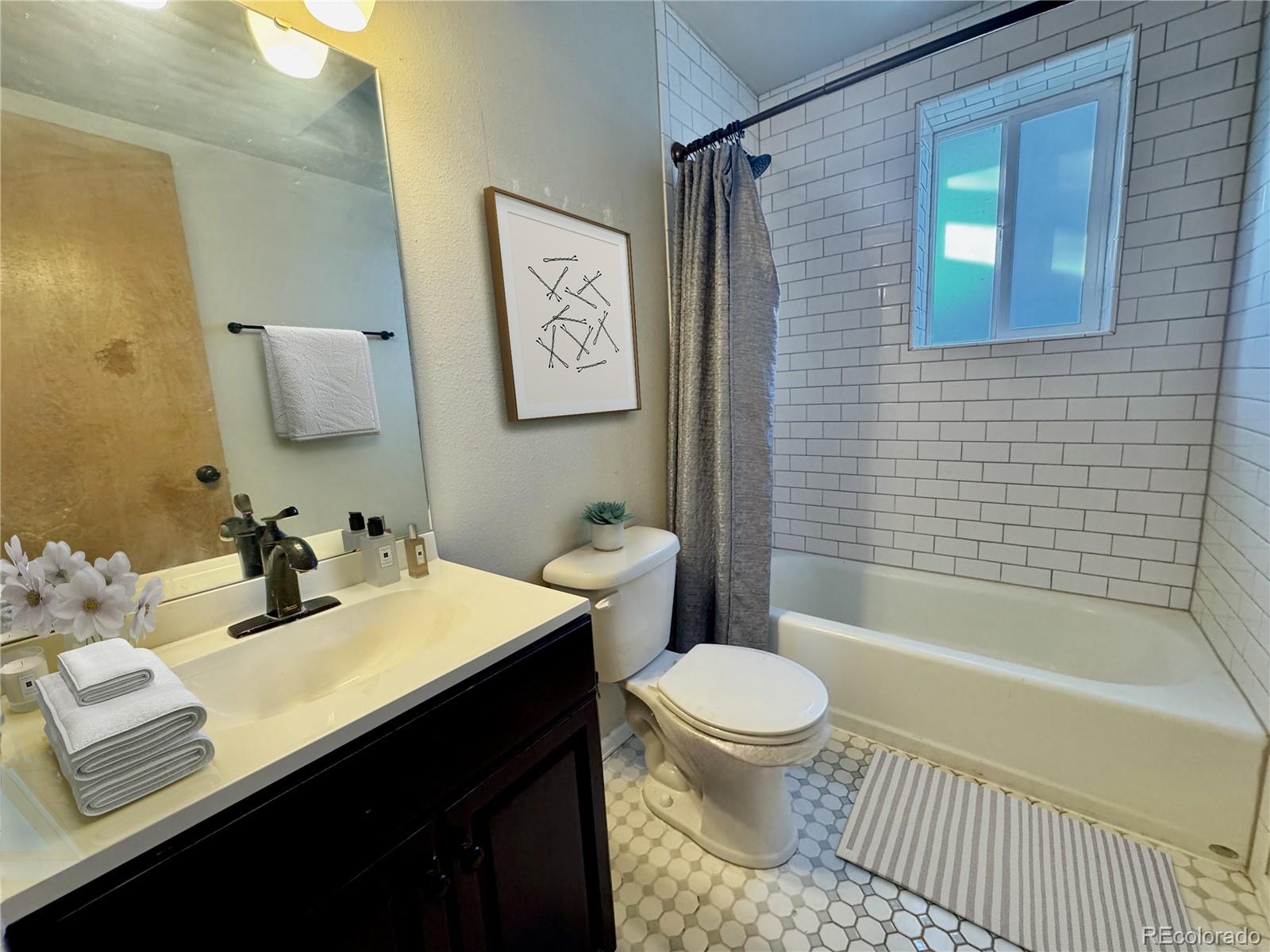 401 Rider Road Rangely, CO 81648 - Photo 6 of 23 a bathroom with a sink toilet and shower