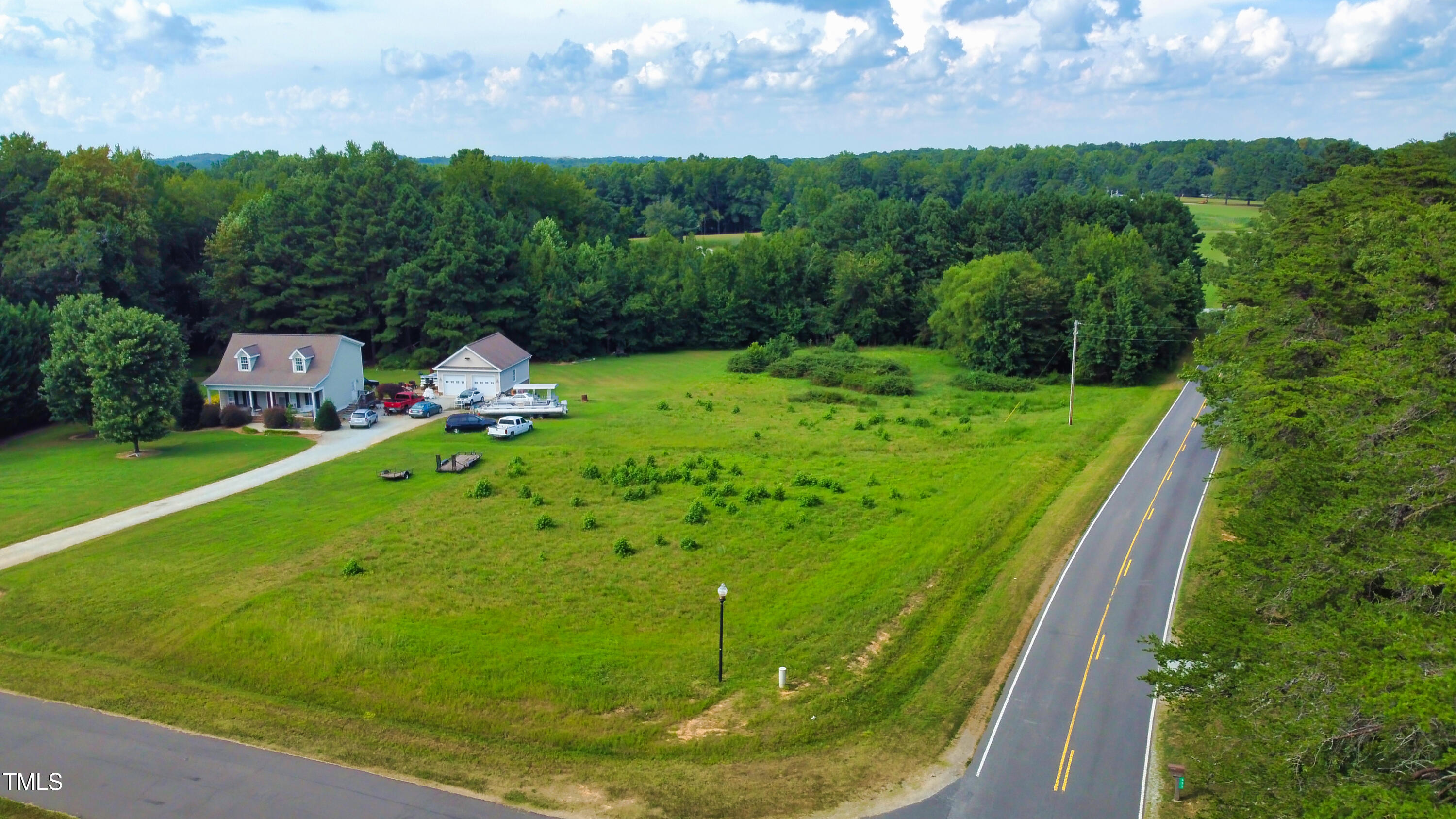 0 Weaver Ridge Road Rougemont, NC 27572 - Photo 11 of 15 a view of a garden with a houses in the background