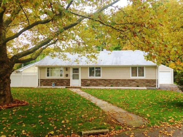 153 Jourmire Road Bridgeport, CT 06606 - Photo 1 of 1 a front view of a house with a yard