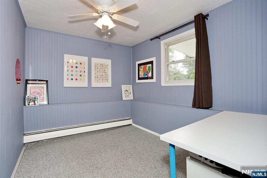 87 Barbara Road Dumont, NJ 07628 - Photo 33 of 48 an empty room with windows and fan