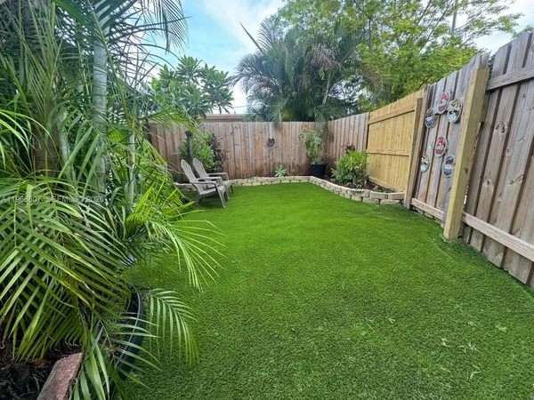 a garden filled with lots of potted plants