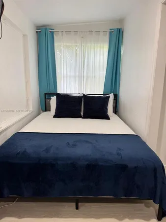 a living room with a bed