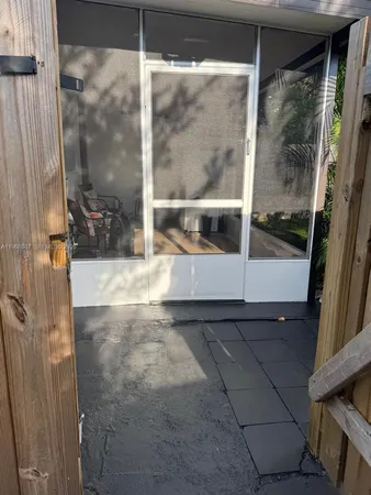 a view of a glass door of the house