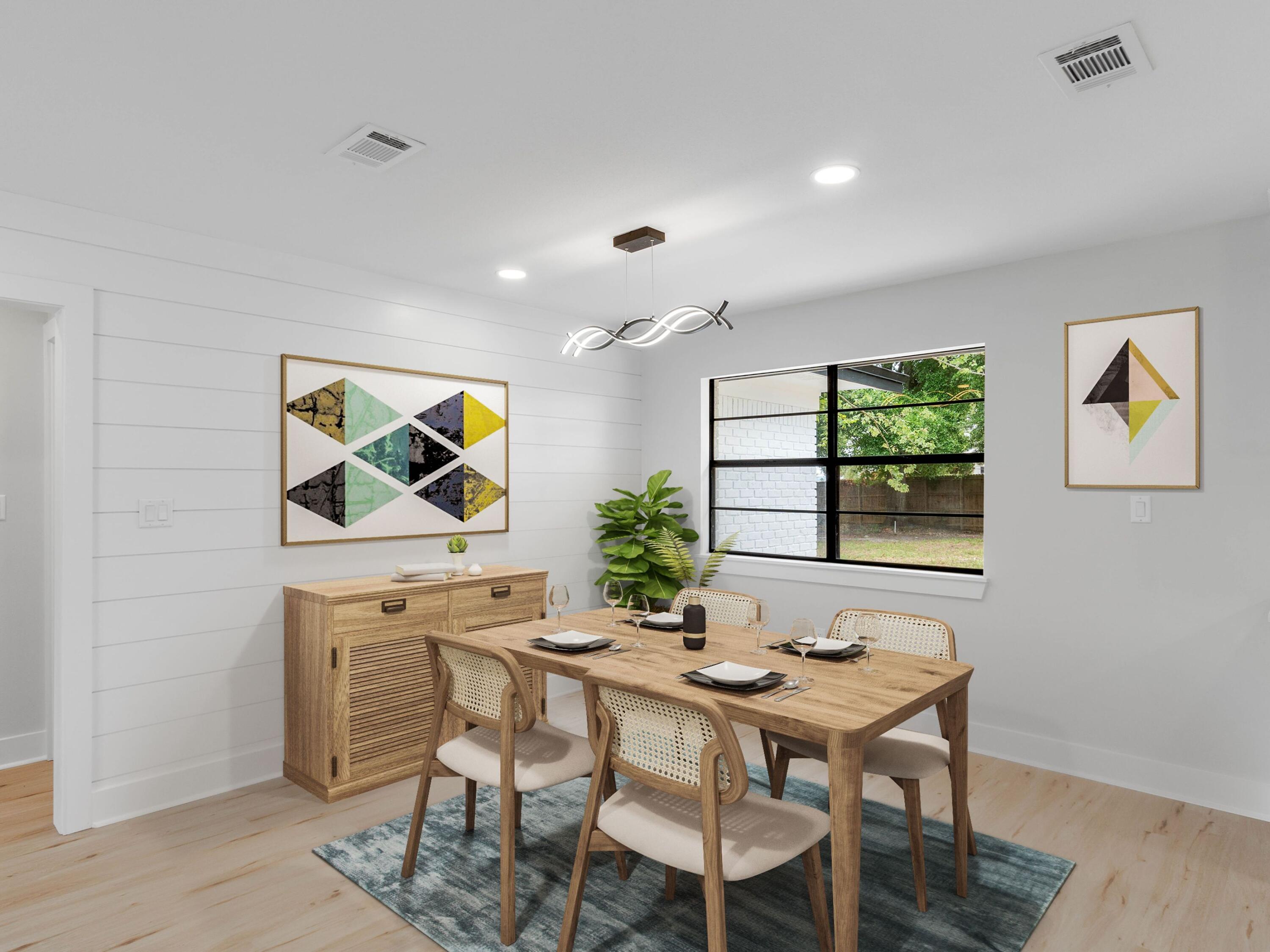 609 Sea View Circle Destin, FL 32541 - Photo 11 of 45 a view of a dining room with furniture window and wooden floor