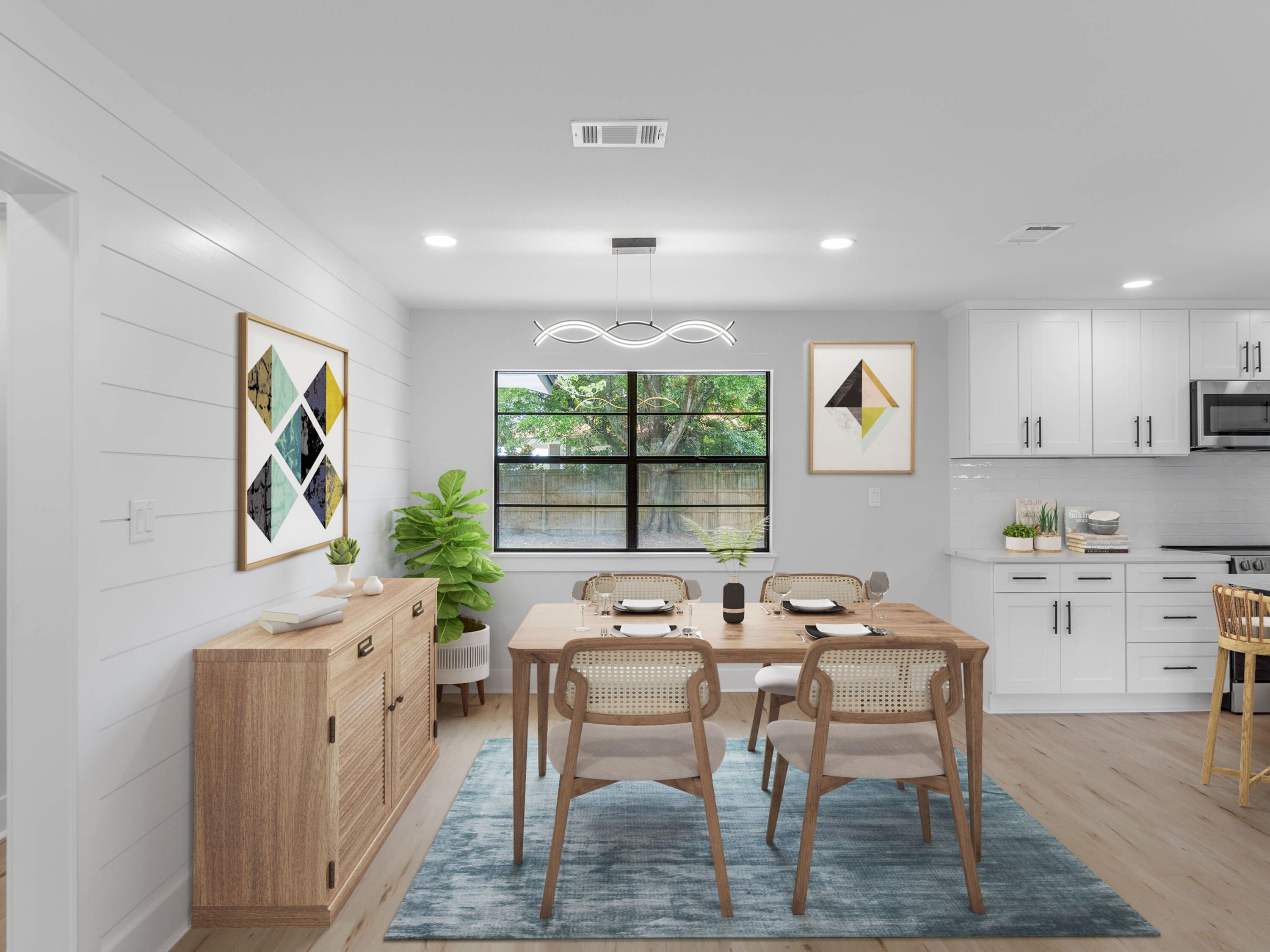 609 Sea View Circle Destin, FL 32541 - Photo 13 of 45 a dining room with furniture a window and a kitchen view