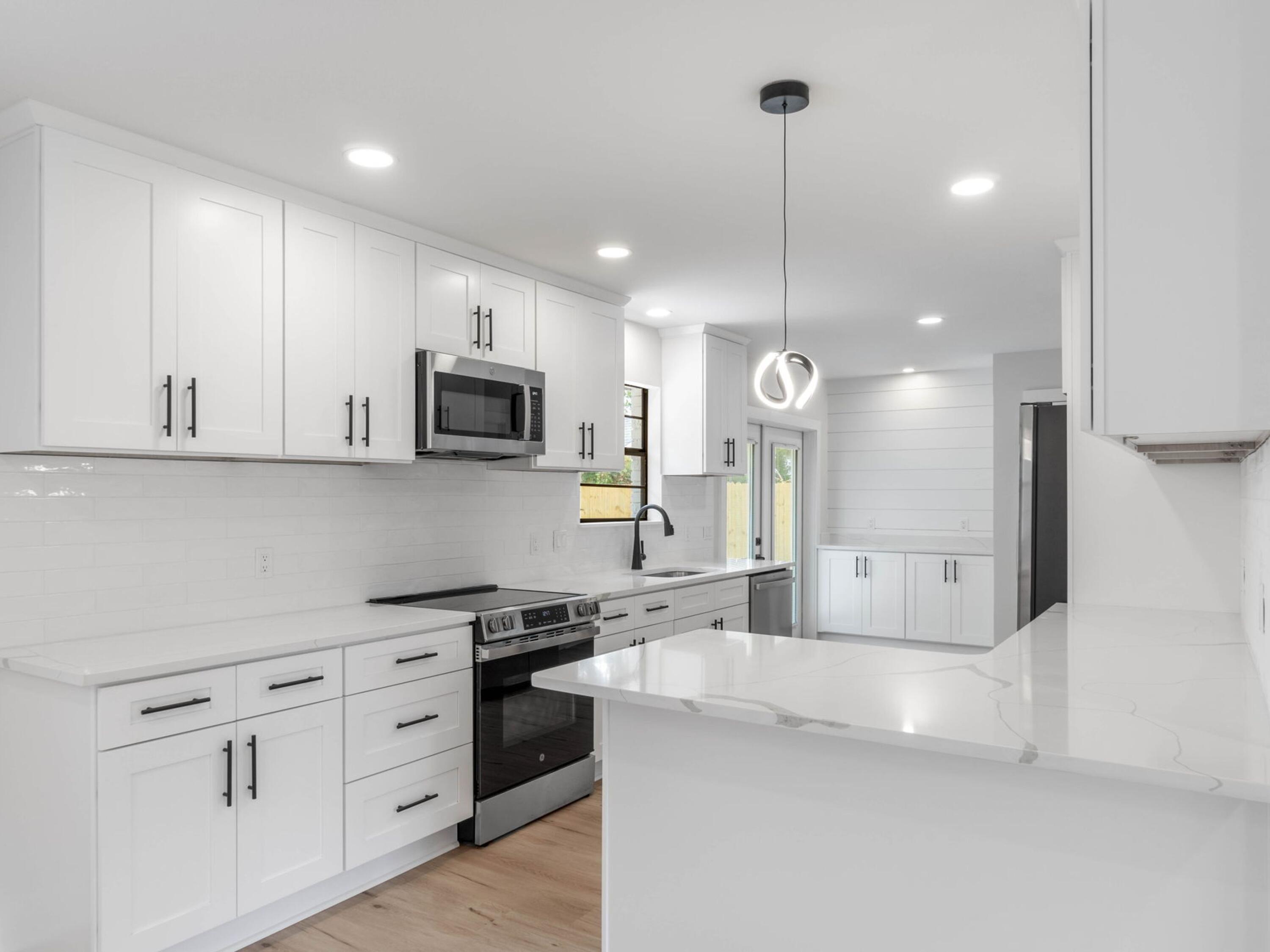 609 Sea View Circle Destin, FL 32541 - Photo 14 of 45 a large kitchen with cabinets