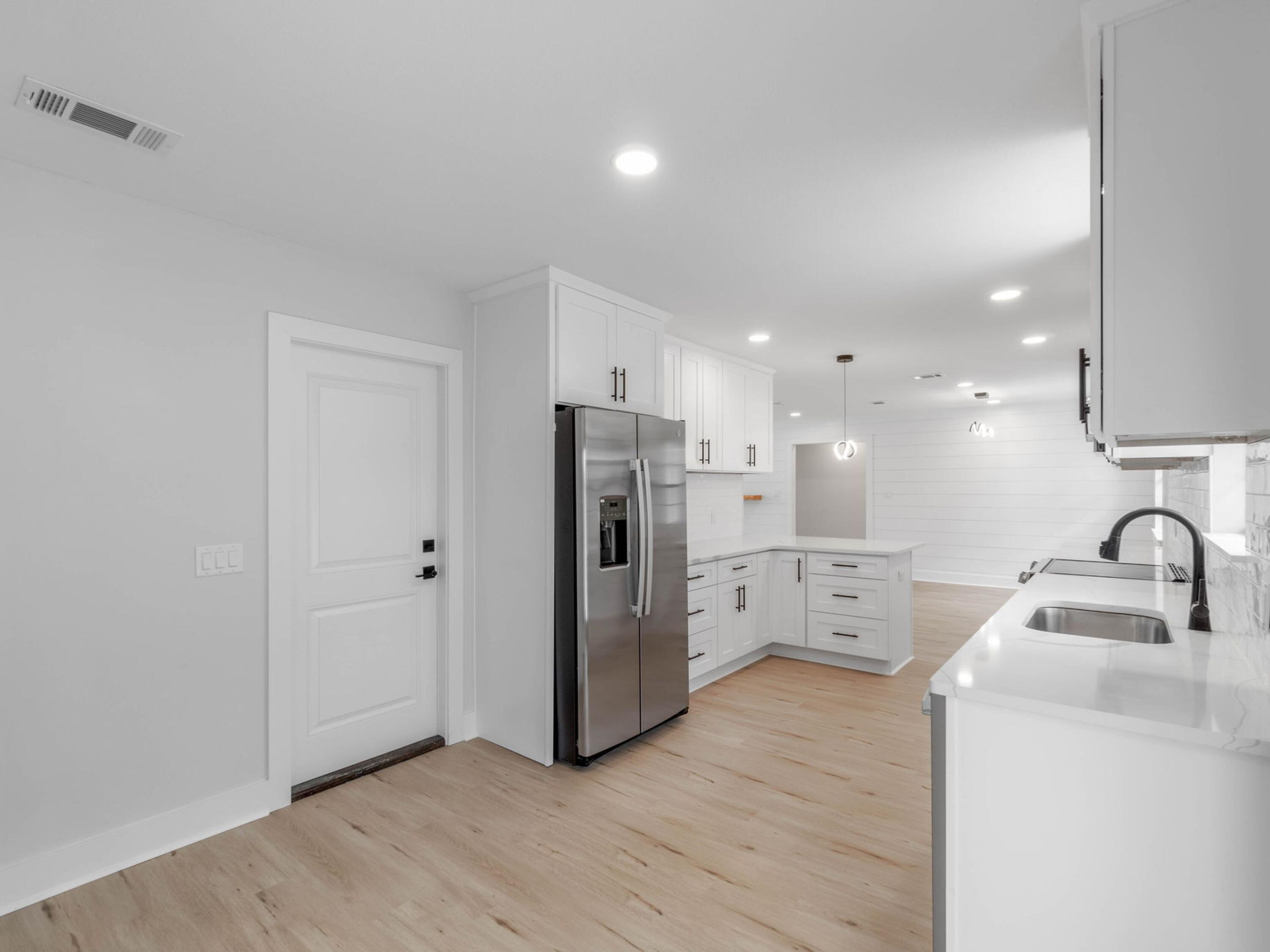 609 Sea View Circle Destin, FL 32541 - Photo 15 of 45 a kitchen with stainless steel appliances a refrigerator and a sink
