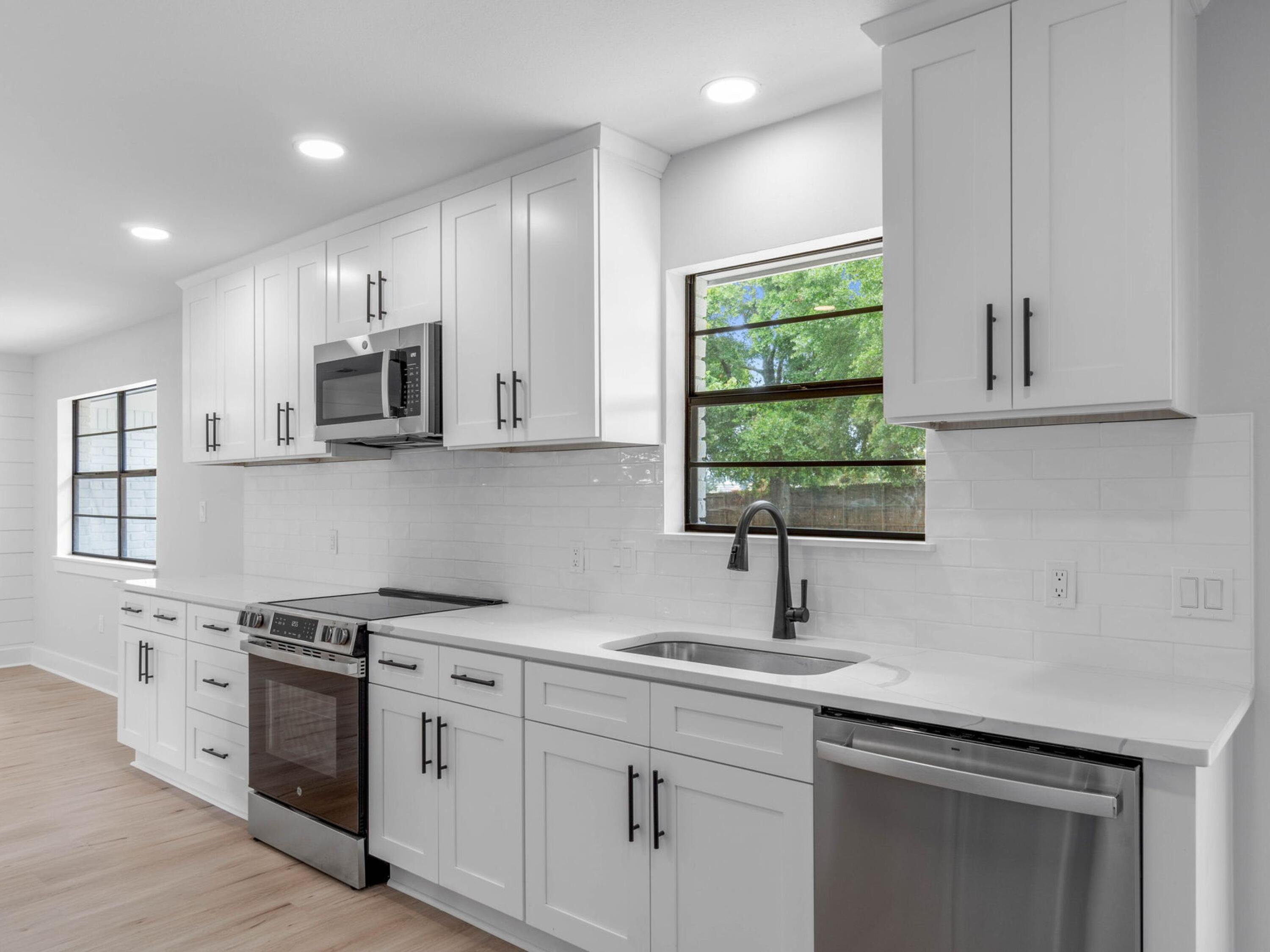 609 Sea View Circle Destin, FL 32541 - Photo 18 of 45 a kitchen with appliances cabinets and a sink
