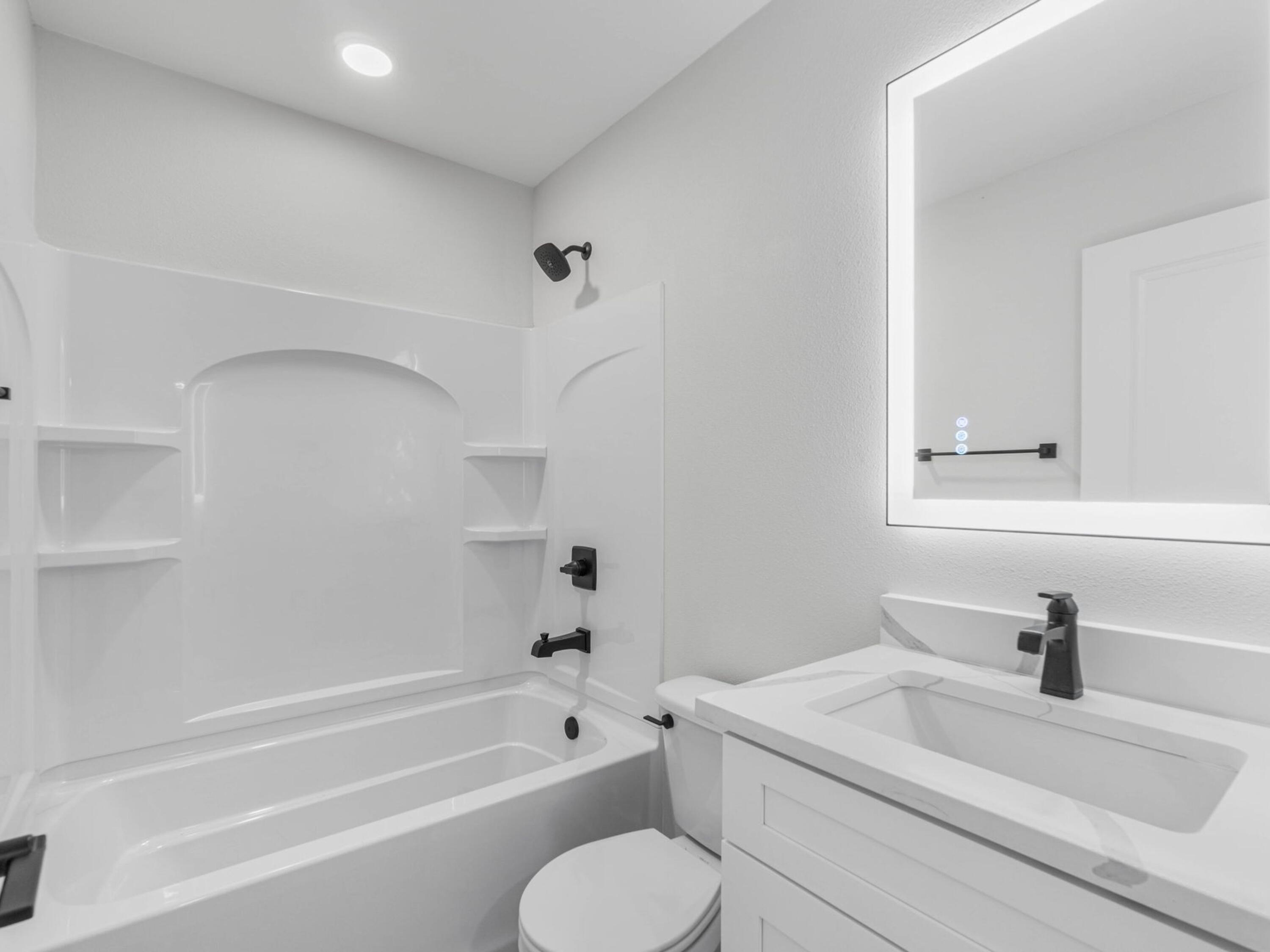 609 Sea View Circle Destin, FL 32541 - Photo 28 of 45 a bathroom with a sink toilet vanity and bathtub