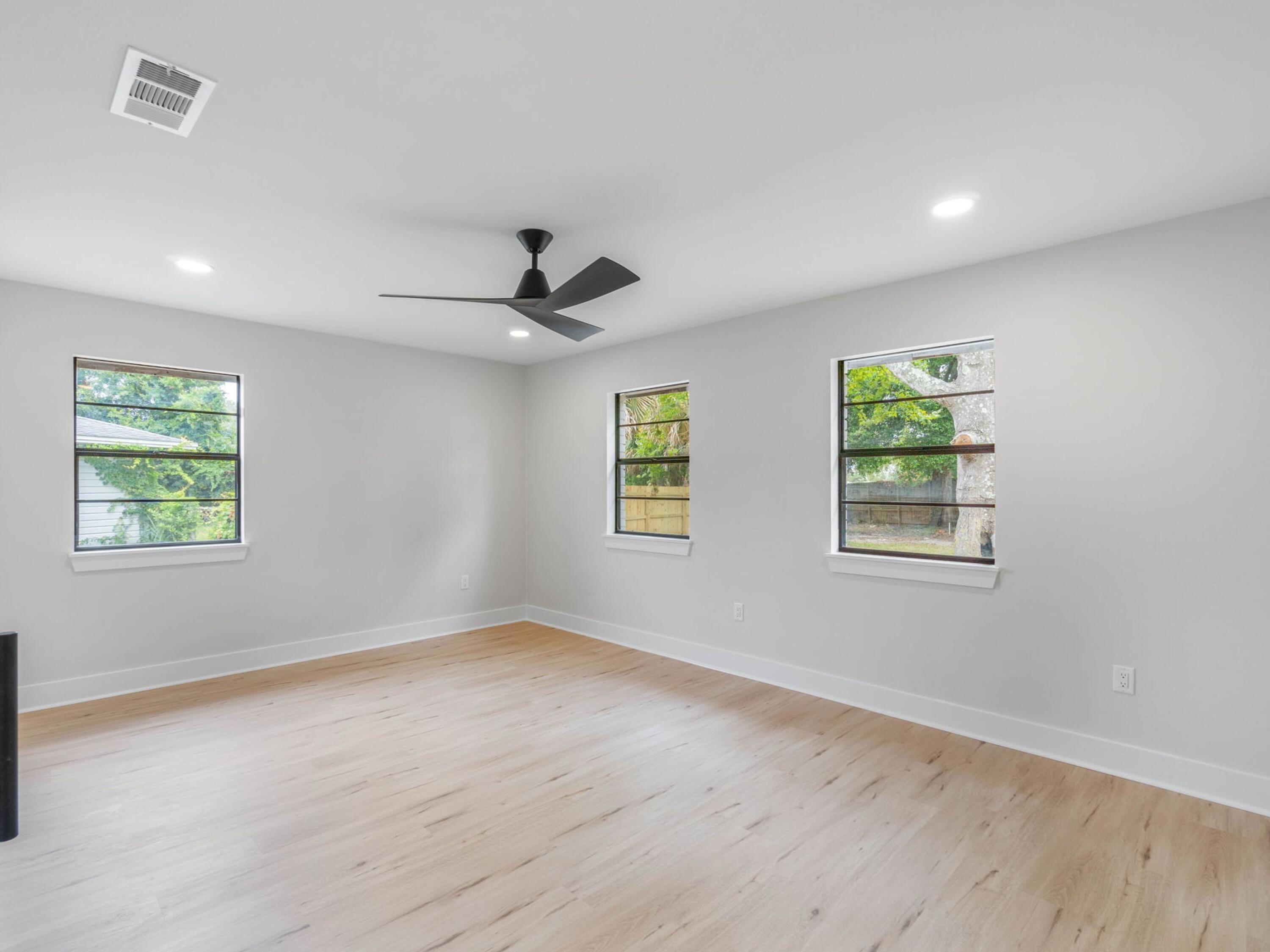 609 Sea View Circle Destin, FL 32541 - Photo 29 of 45 a view of empty room with wooden floor and fan