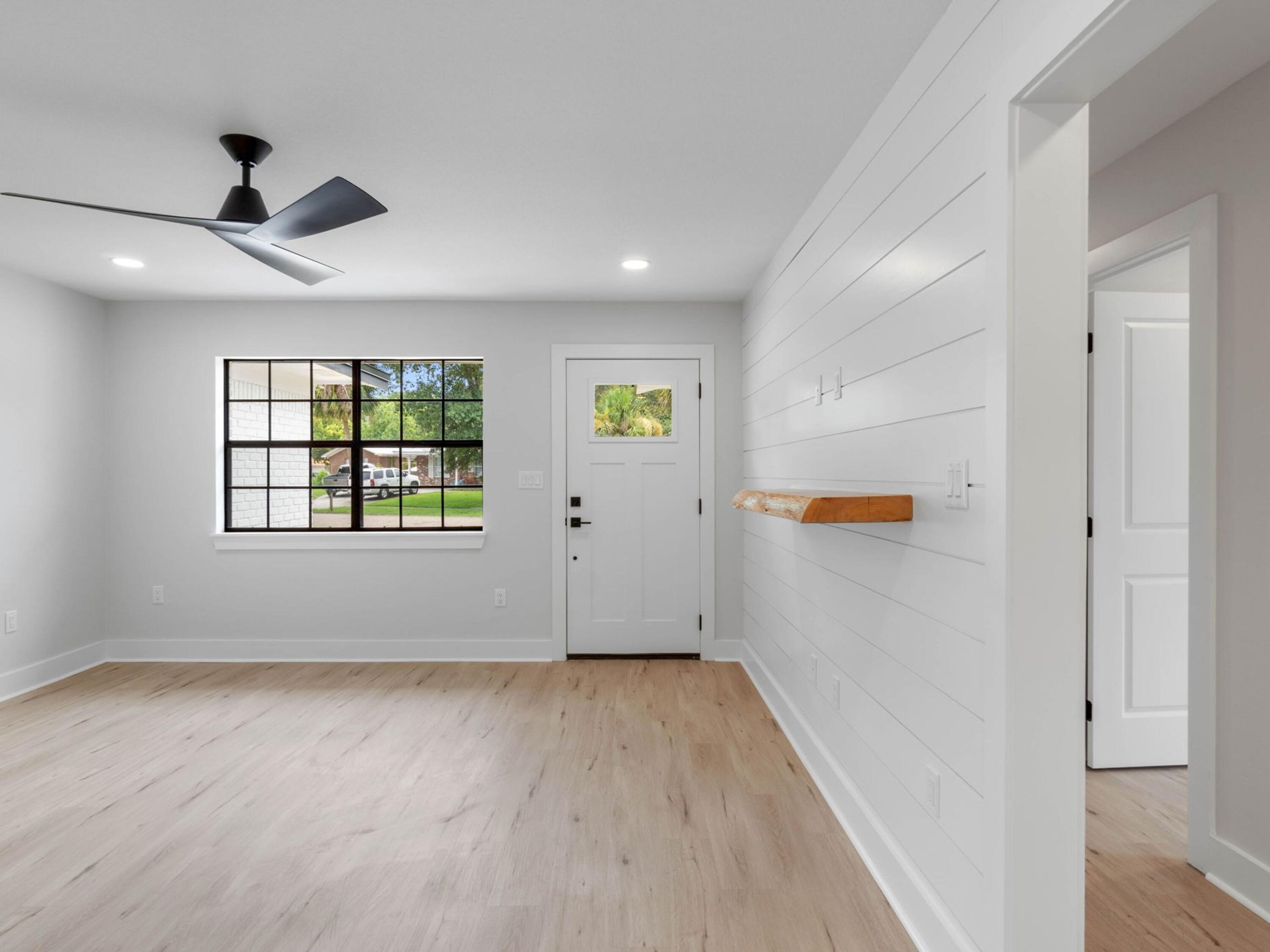 609 Sea View Circle Destin, FL 32541 - Photo 3 of 45 wooden floor in an empty room with a window