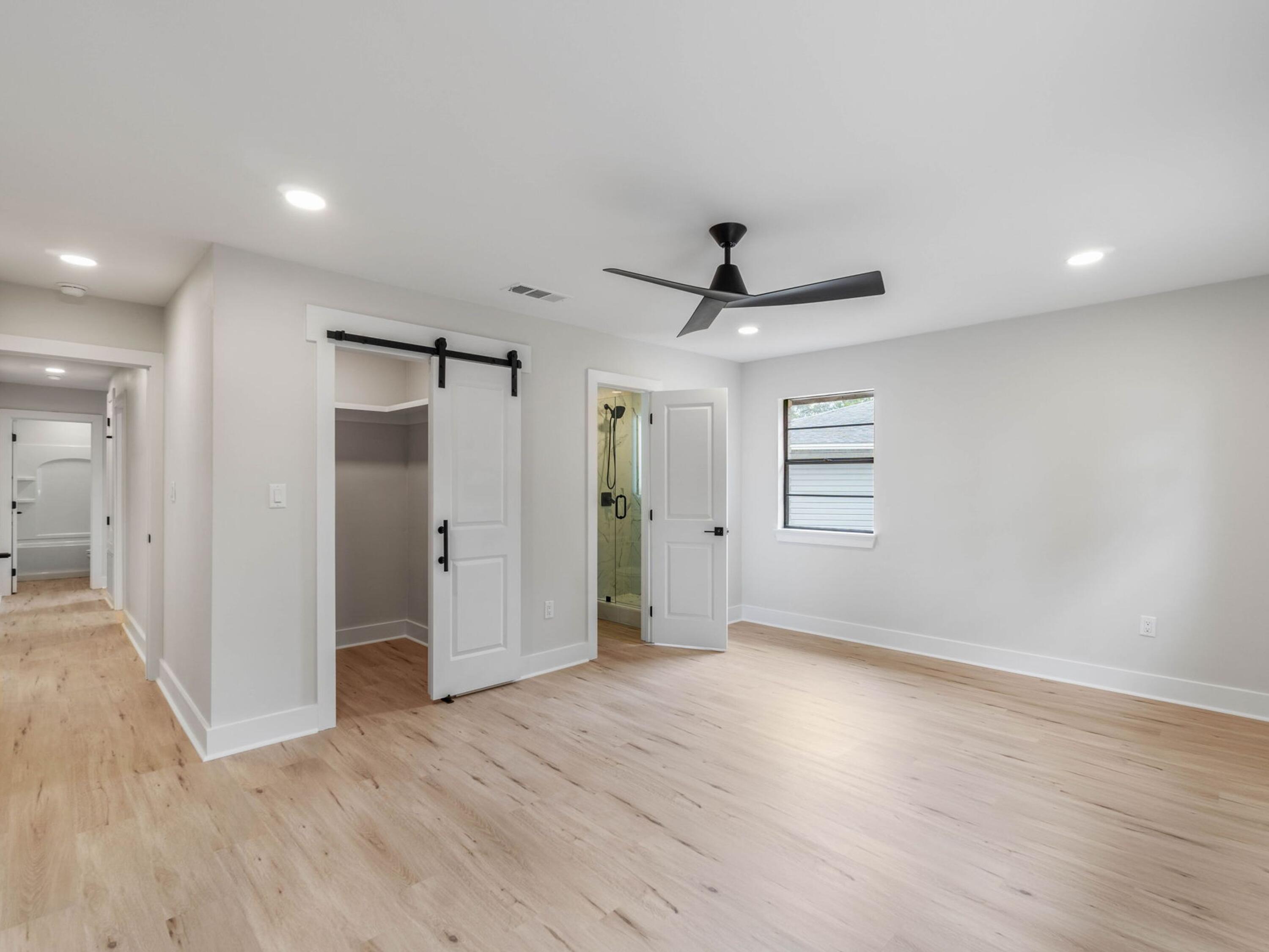 609 Sea View Circle Destin, FL 32541 - Photo 31 of 45 a view of empty room with wooden floor and window