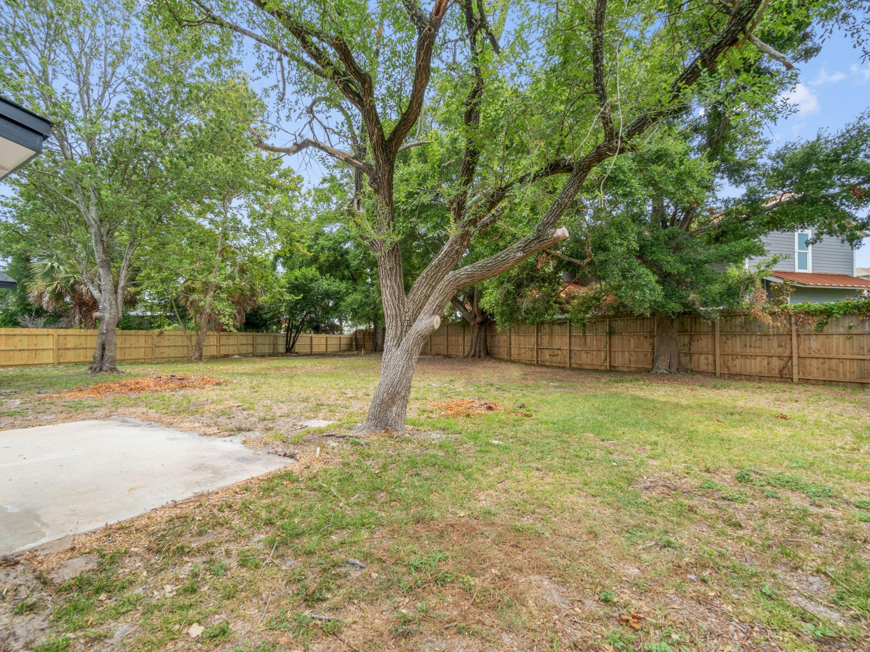 609 Sea View Circle Destin, FL 32541 - Photo 36 of 45 a view of a yard with a tree