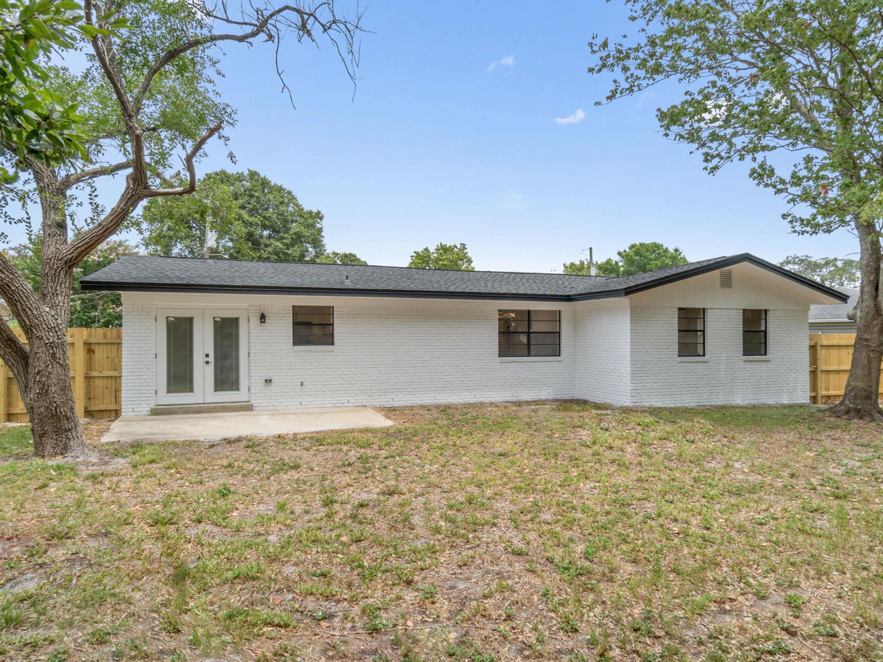 609 Sea View Circle Destin, FL 32541 - Photo 38 of 45 a view of a house with a yard