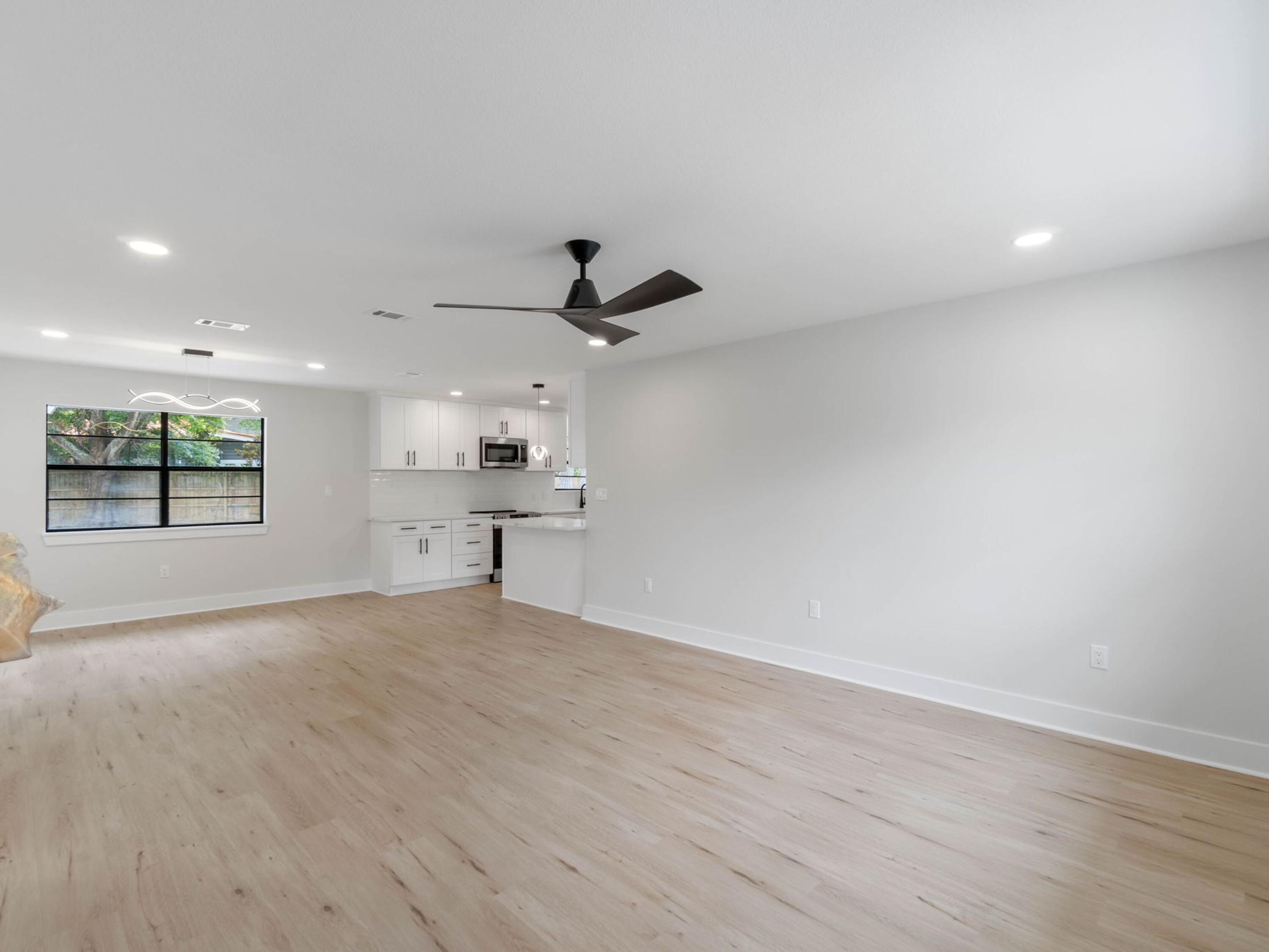 609 Sea View Circle Destin, FL 32541 - Photo 4 of 45 an empty room with windows and ceiling fan
