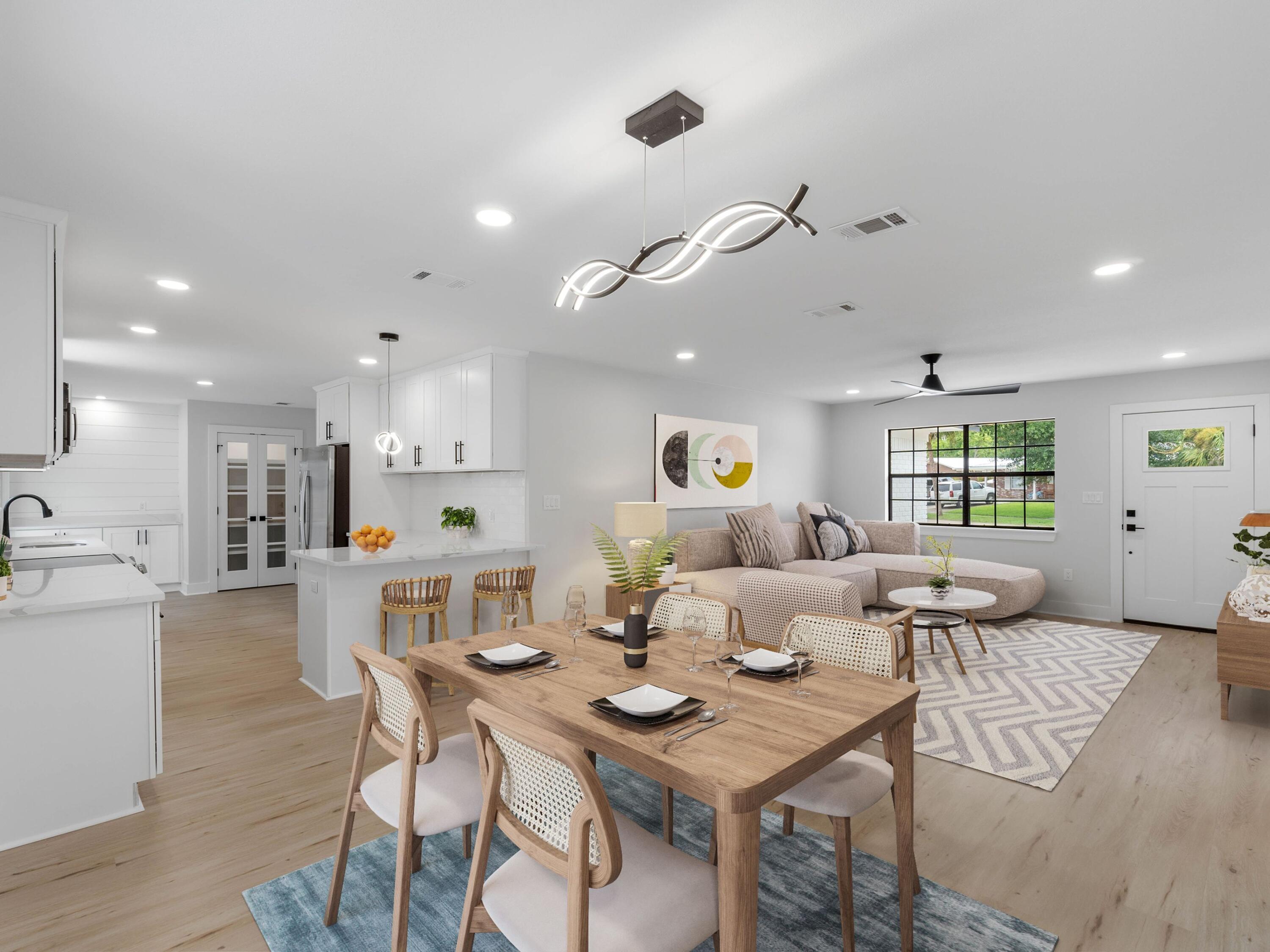 609 Sea View Circle Destin, FL 32541 - Photo 9 of 45 a living room with kitchen island furniture and a wooden floor