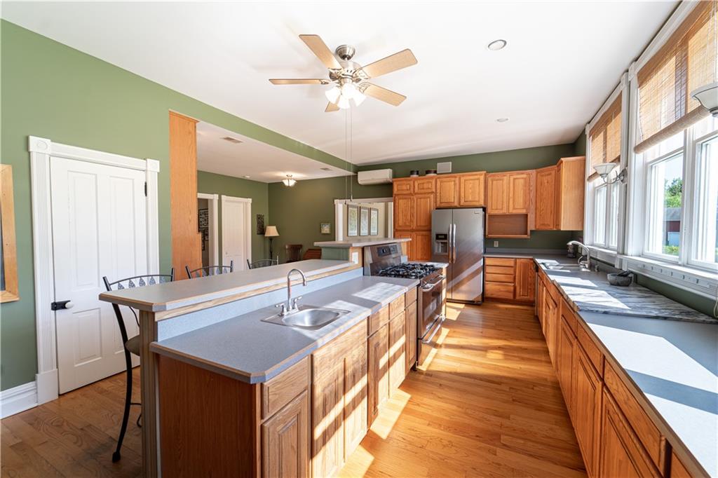 532 Campground Road West Middlesex, PA 16159 - Photo 11 of 25 a dining hall with stainless steel appliances kitchen island furniture and a large window