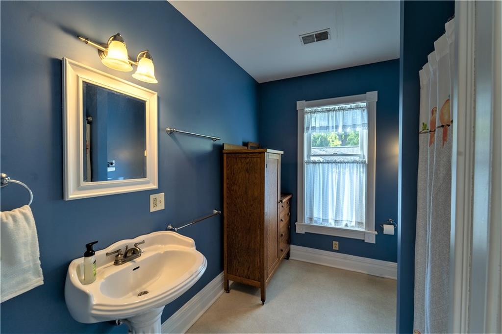 532 Campground Road West Middlesex, PA 16159 - Photo 19 of 25 a bathroom with a sink and a mirror