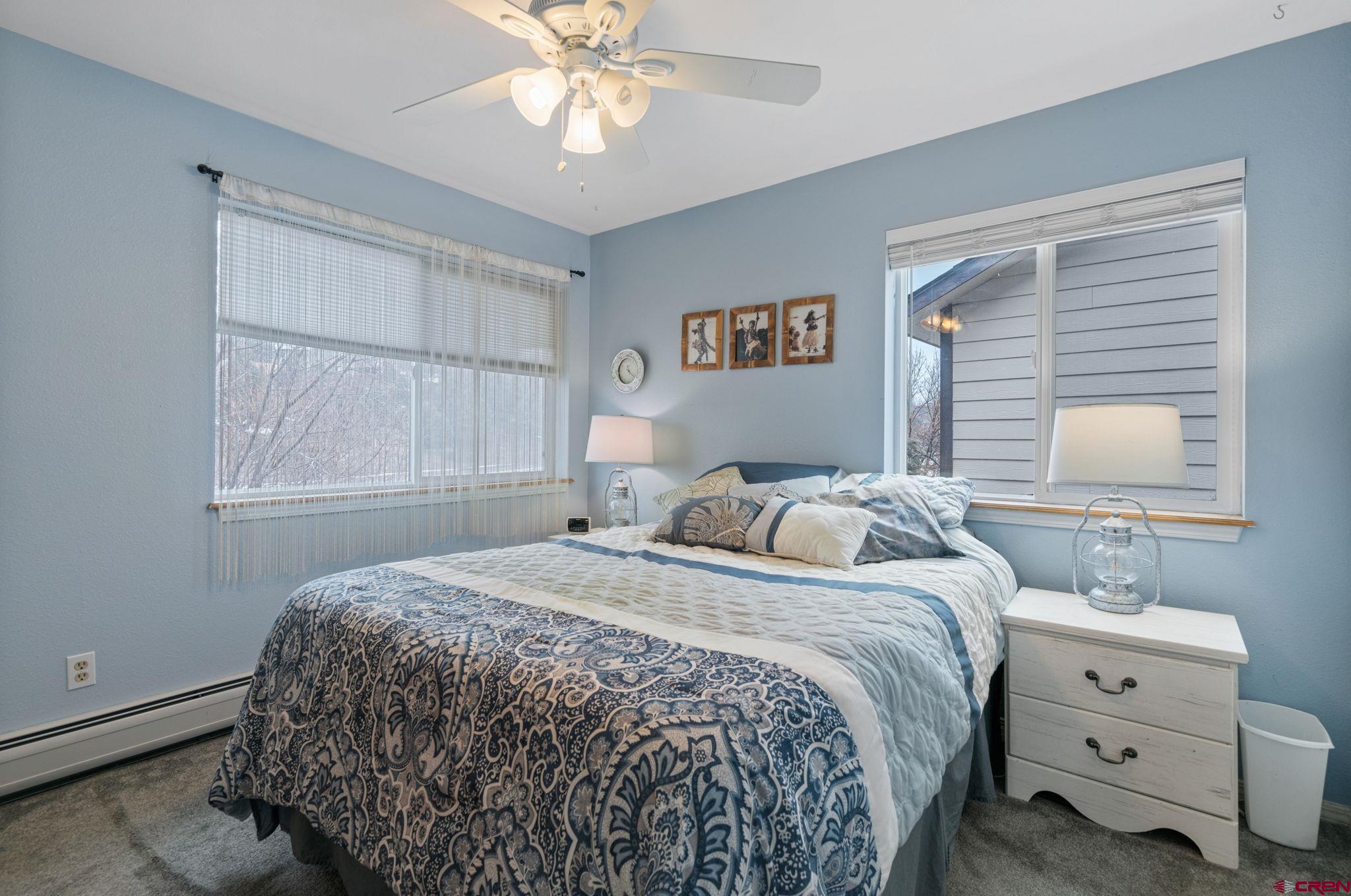 233 Jenkins Ranch Road, Unit B Durango, CO 81301 - Photo 10 of 20 a bedroom with a bed and a window