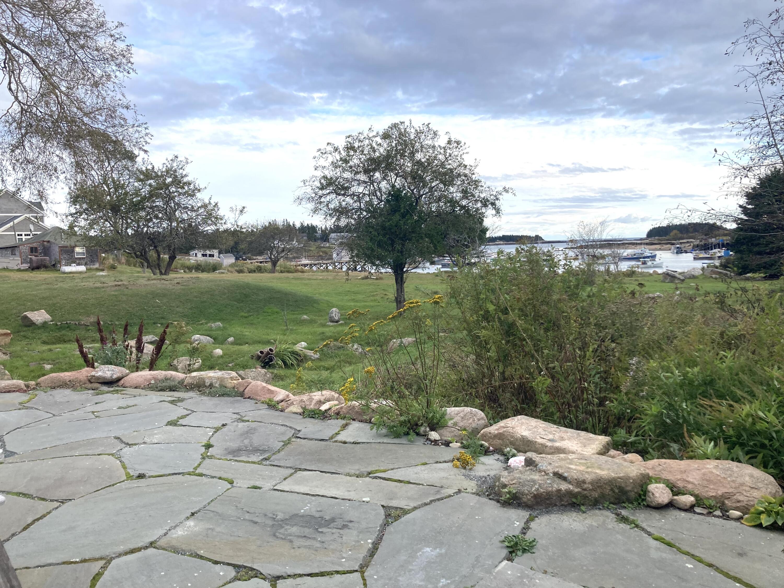 21 Crowley Island Road Corea, ME 04624 - Photo 5 of 22 Patio to meadow.
