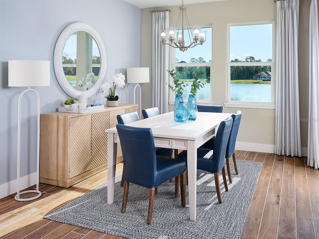1004 British Circle Daytona Beach, FL 32124 - Photo 3 of 8 a view of a dining room with furniture window and wooden floor