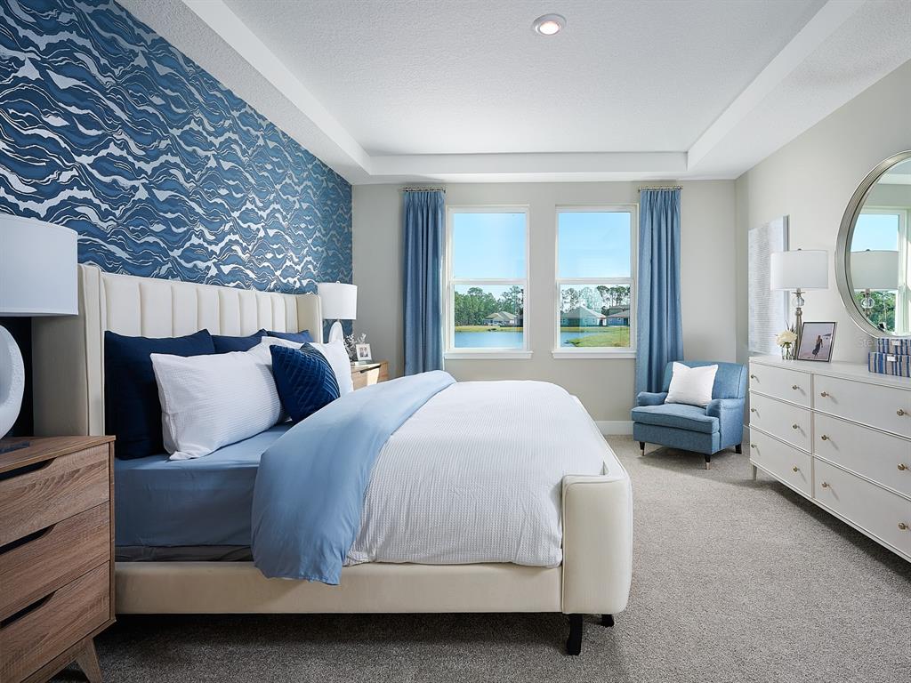 1004 British Circle Daytona Beach, FL 32124 - Photo 6 of 8 a bedroom with a large bed and a large window