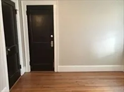 a view of a small space with wooden floor