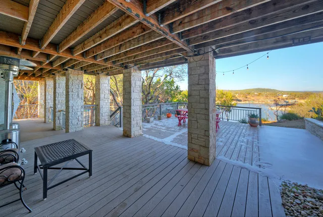 a view of a porch with wooden floor