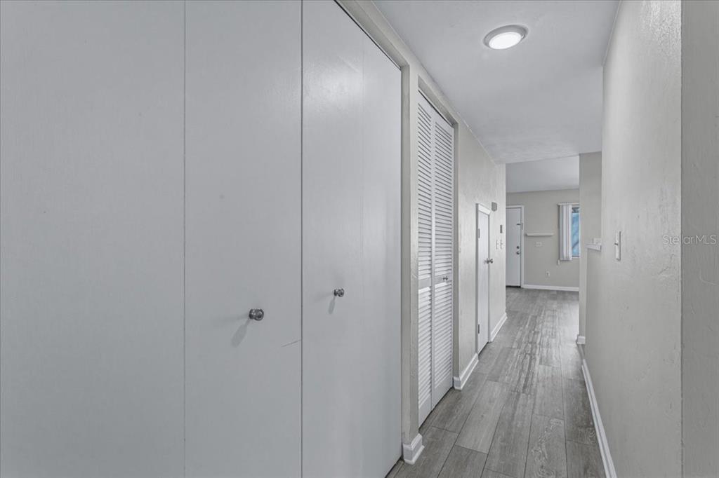 2508 Southwest 35th Place, Unit D19 Gainesville, FL 32608 - Photo 13 of 25 a view of a hallway with wooden floor