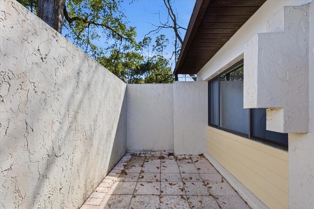 2508 Southwest 35th Place, Unit D19 Gainesville, FL 32608 - Photo 2 of 25 a bathroom with a sink and a mirror