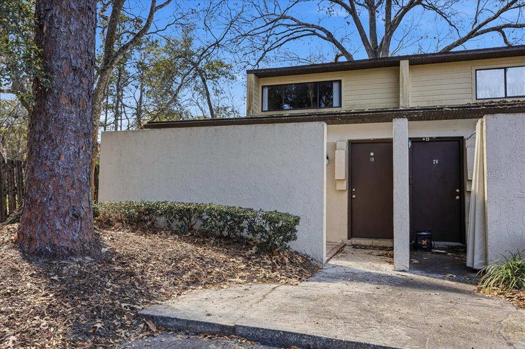 2508 Southwest 35th Place, Unit D19 Gainesville, FL 32608 - Photo 25 of 25 a view of a house with a yard