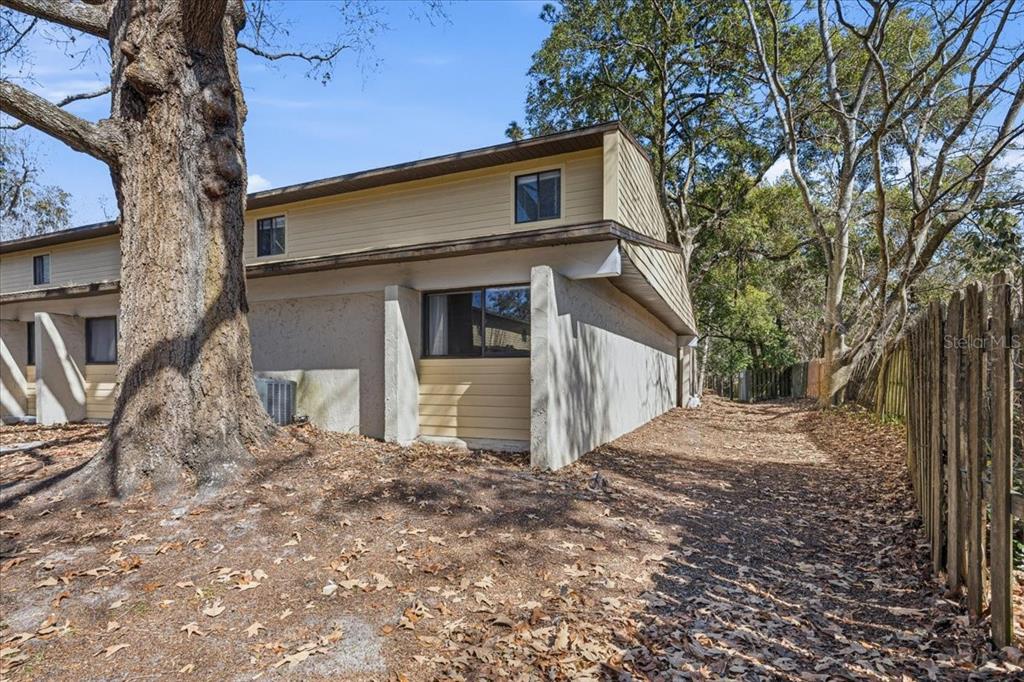 2508 Southwest 35th Place, Unit D19 Gainesville, FL 32608 - Photo 3 of 25 a front view of a house with garden