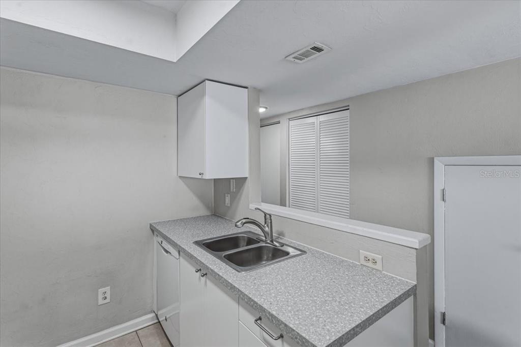 2508 Southwest 35th Place, Unit D19 Gainesville, FL 32608 - Photo 9 of 25 a kitchen with a stove and a sink