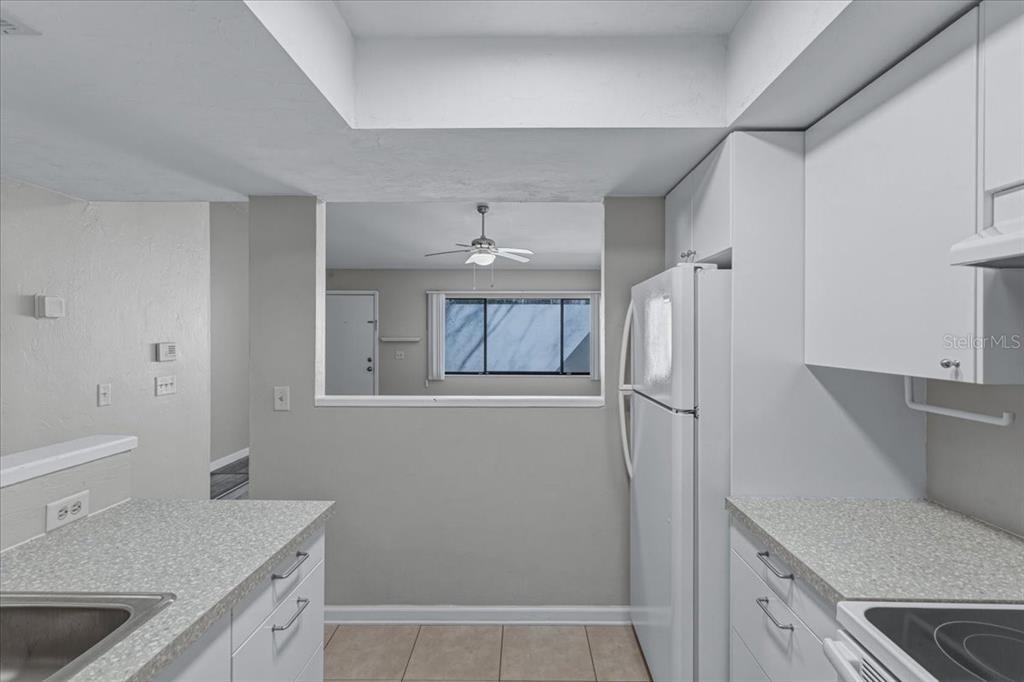 2508 Southwest 35th Place, Unit D19 Gainesville, FL 32608 - Photo 10 of 25 a kitchen with a sink and a refrigerator