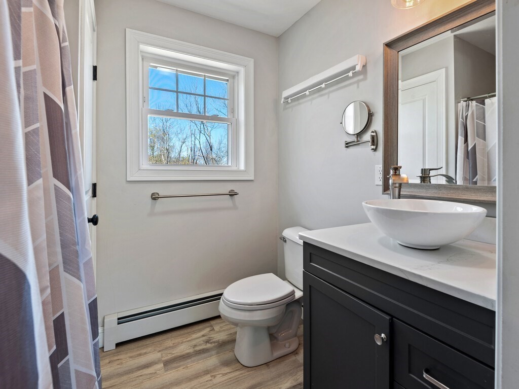 56 Carter Road Westminster, MA 01473 - Photo 20 of 36 a bathroom with a granite countertop sink toilet a mirror and shower