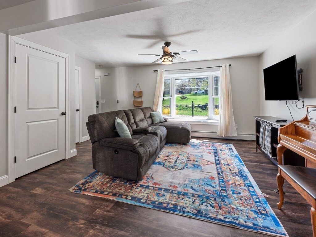 56 Carter Road Westminster, MA 01473 - Photo 3 of 36 a living room with furniture and a flat screen tv
