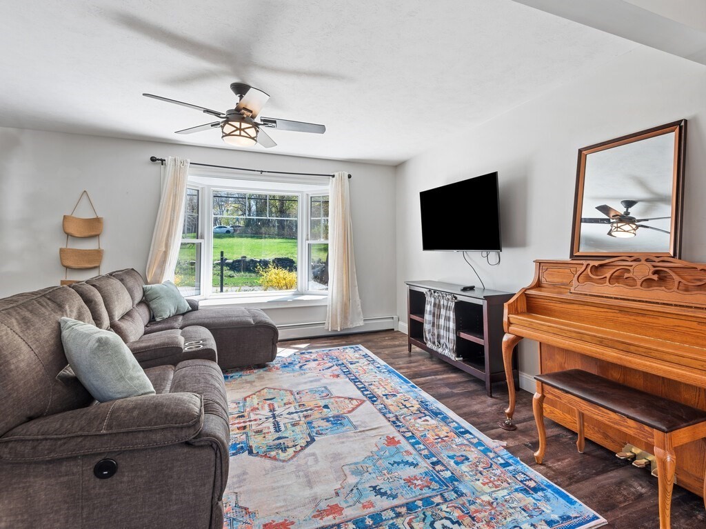 56 Carter Road Westminster, MA 01473 - Photo 4 of 36 a living room with furniture and a flat screen tv
