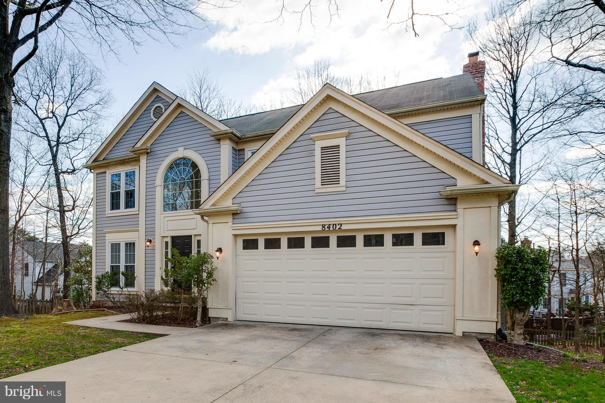 a view of house with a yard