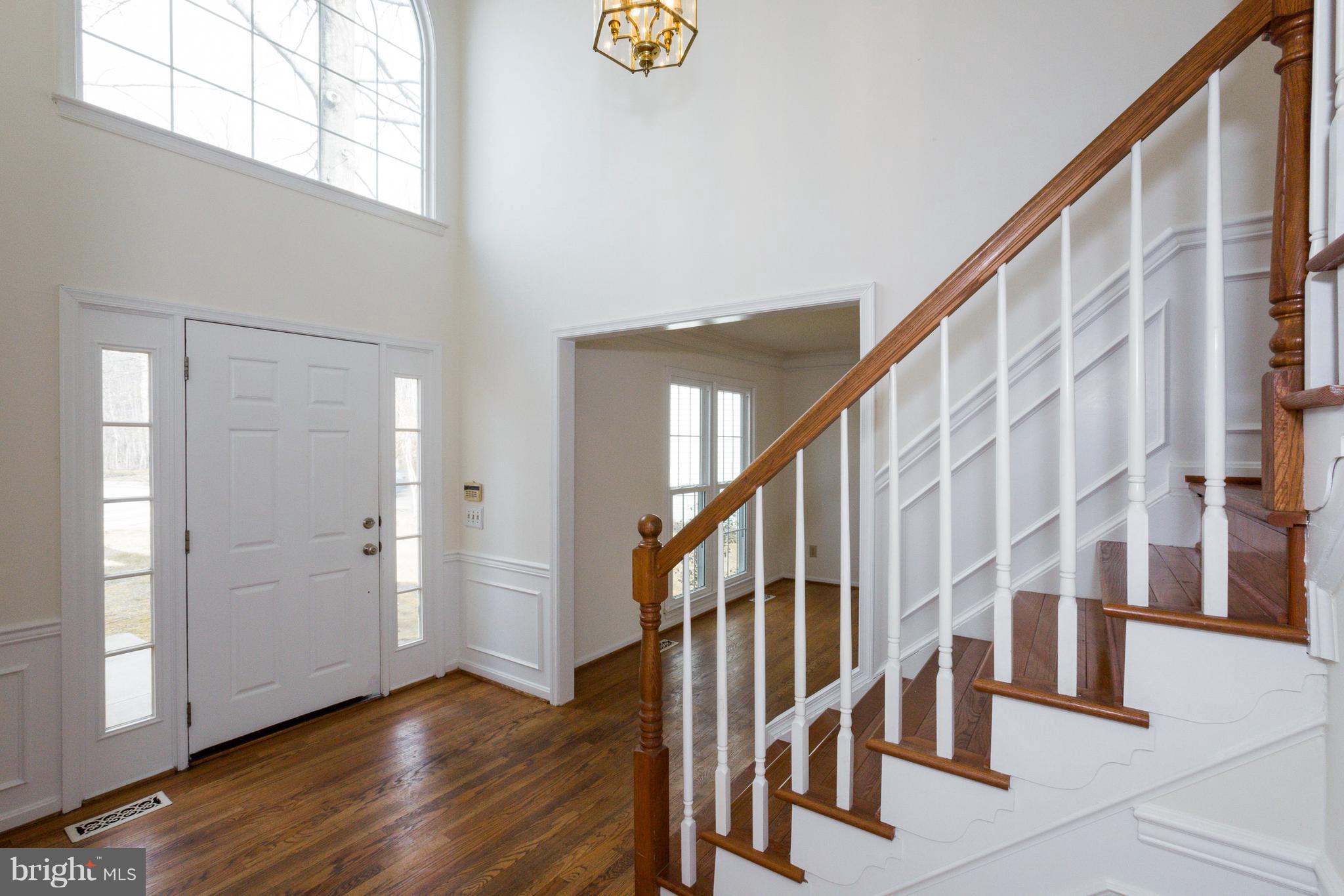 8402 Shadeland Road Laurel, MD 20724 - Photo 2 of 30 a view of an entryway with wooden floor and door