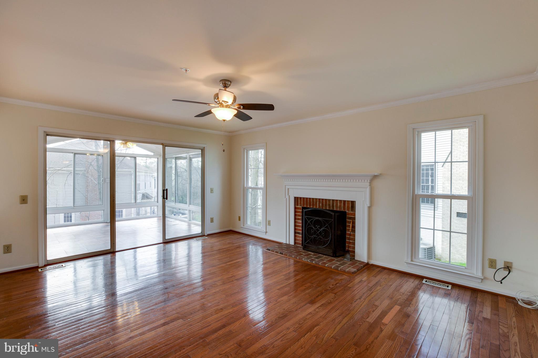 8402 Shadeland Road Laurel, MD 20724 - Photo 11 of 30 a view of an empty room with wooden floor and a window